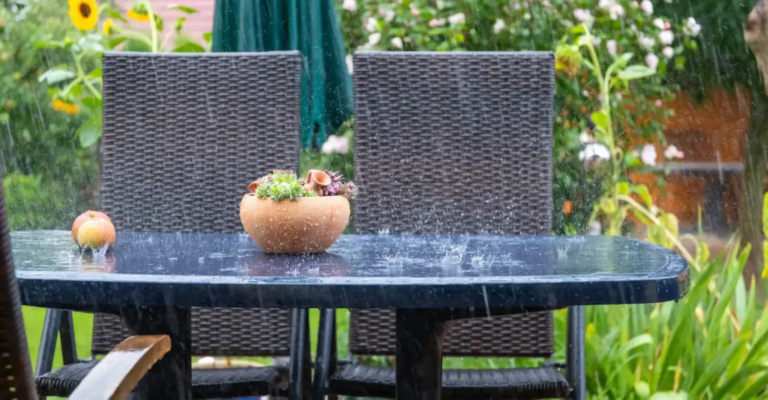 Outdoor furniture setup with wicker chairs and a potted plant on a Geelong patio.