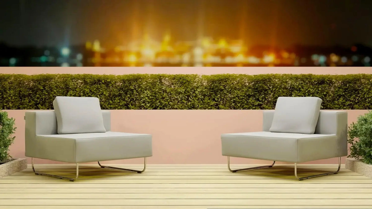 Two modern white armchairs on a wooden deck in stylish outdoor space for winter.