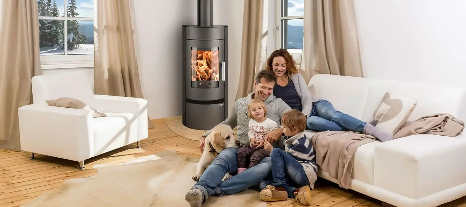 Family enjoying warmth together on a cozy sofa with Euro Fireplaces for natural convection.