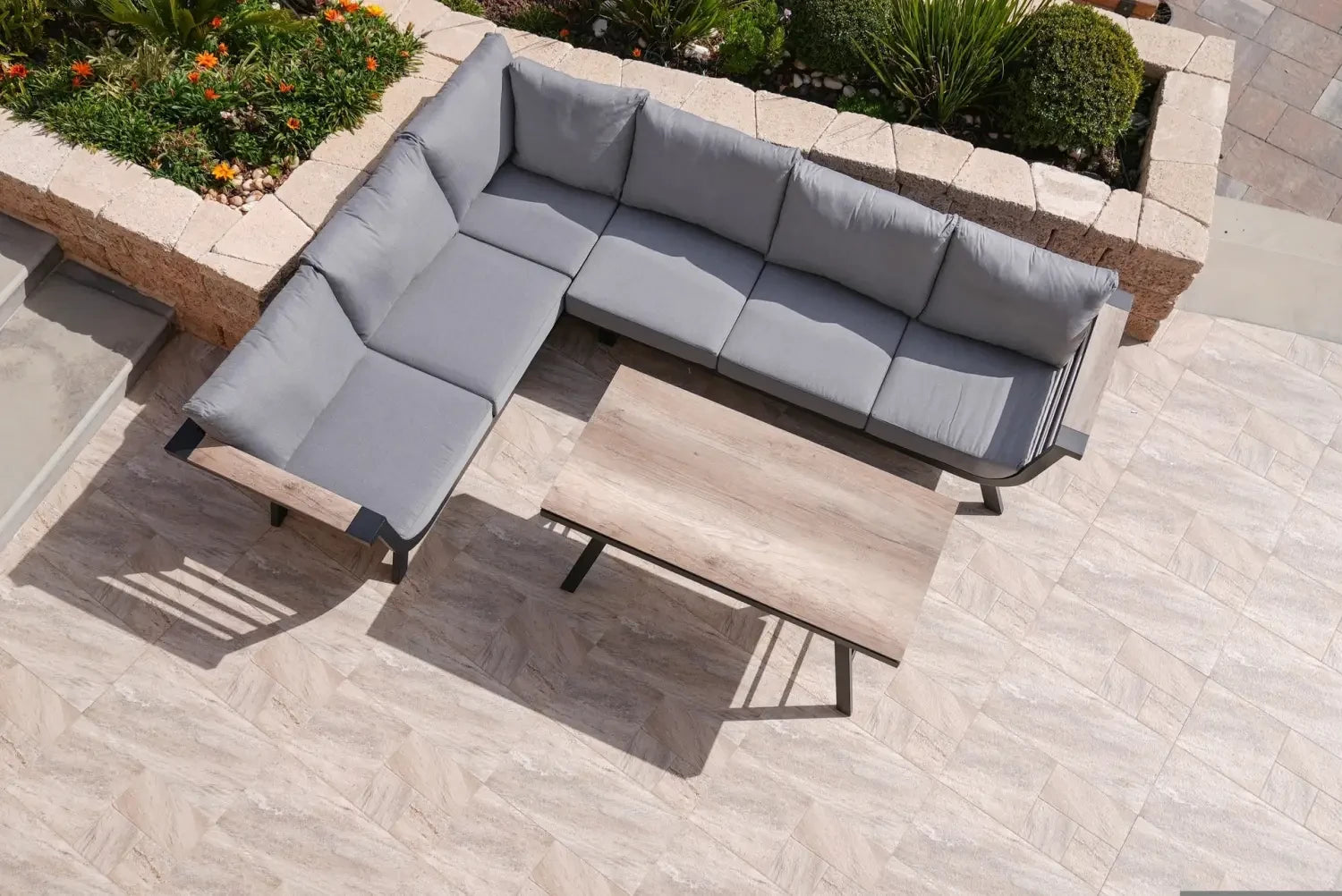 L-shaped outdoor sectional sofa with gray cushions for stylish outdoor furniture care.
