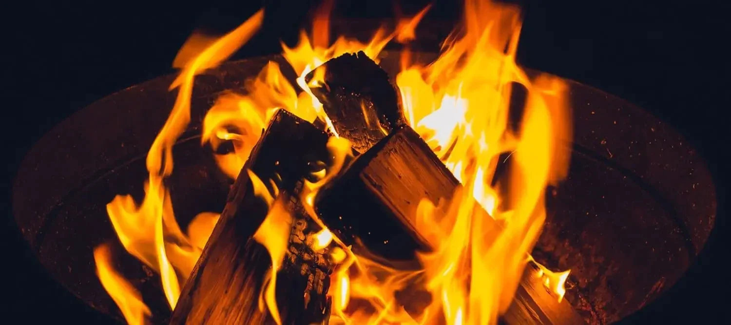 Burning logs with orange flames for a custom project enhancing your fiery outdoors experience.