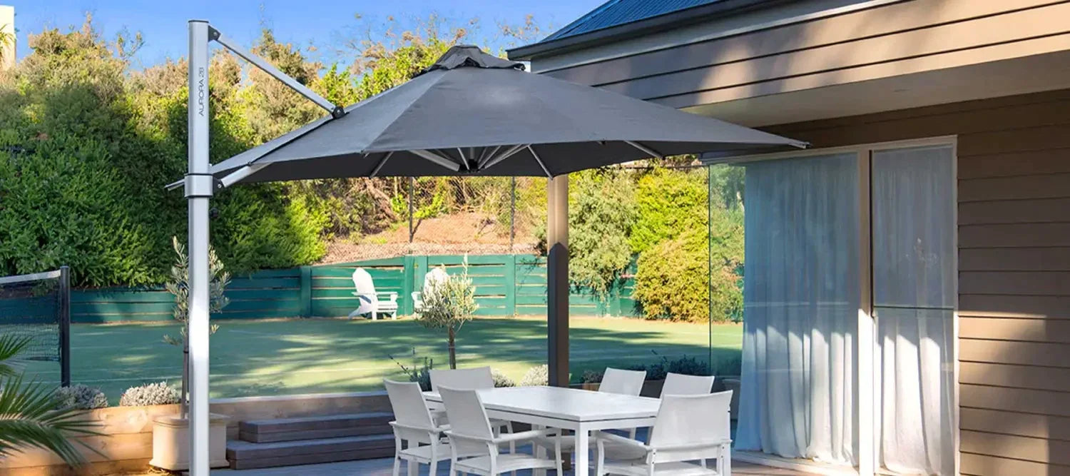 Cantilever patio umbrella providing instant shade for an outdoor dining set in style.