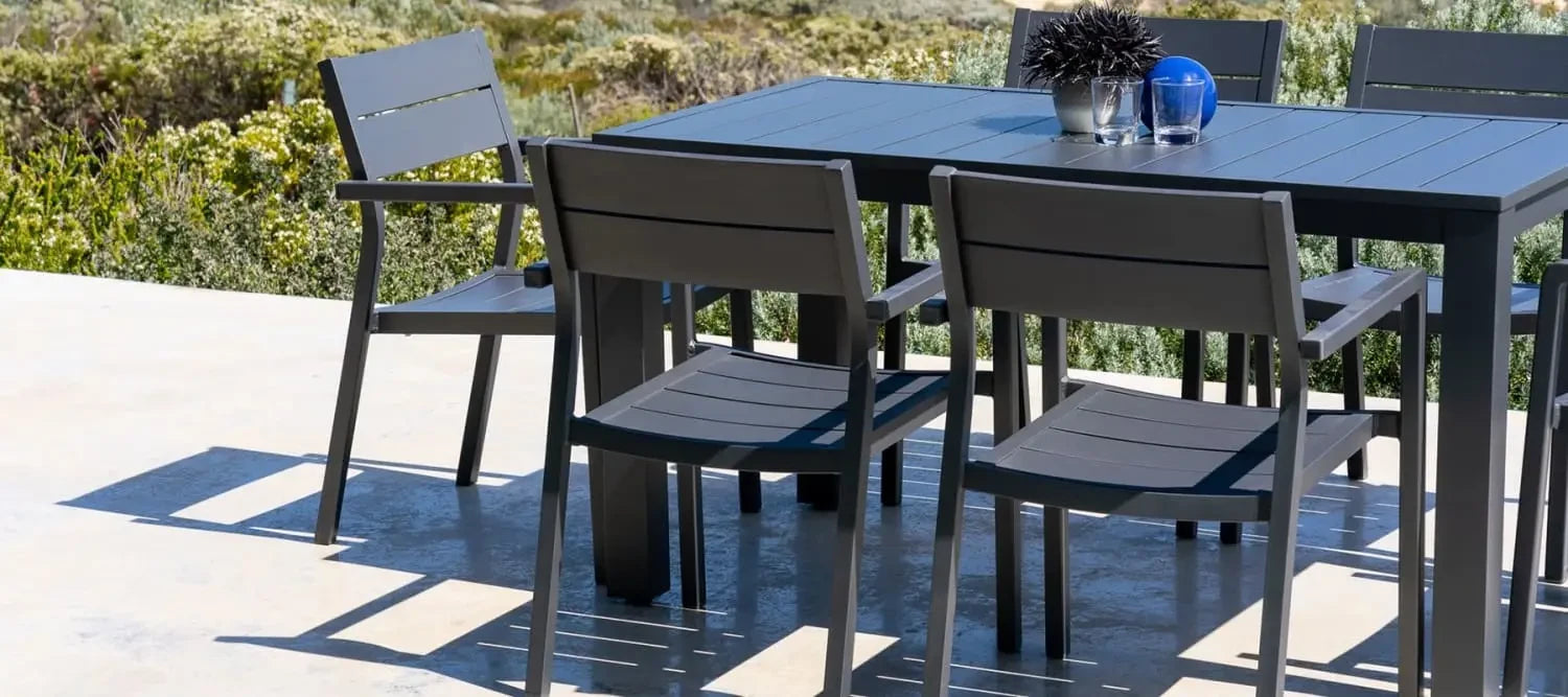 Dark gray outdoor dining set with matching chairs for stylish outdoor furniture spaces
