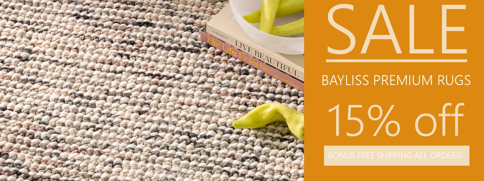 Close-up of gray woven Bayliss Rug showcasing fringe detail and timeless elegance.