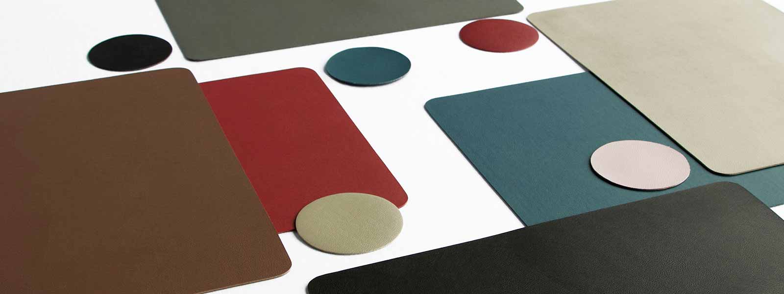 Abstract geometric composition of colorful rectangles and circles on Truman Coasters.