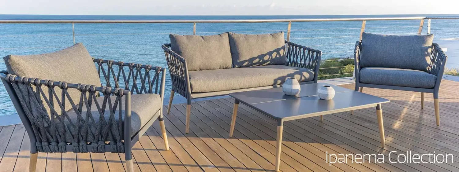 Outdoor patio furniture set featuring woven rope chairs and loveseat for outdoor space.