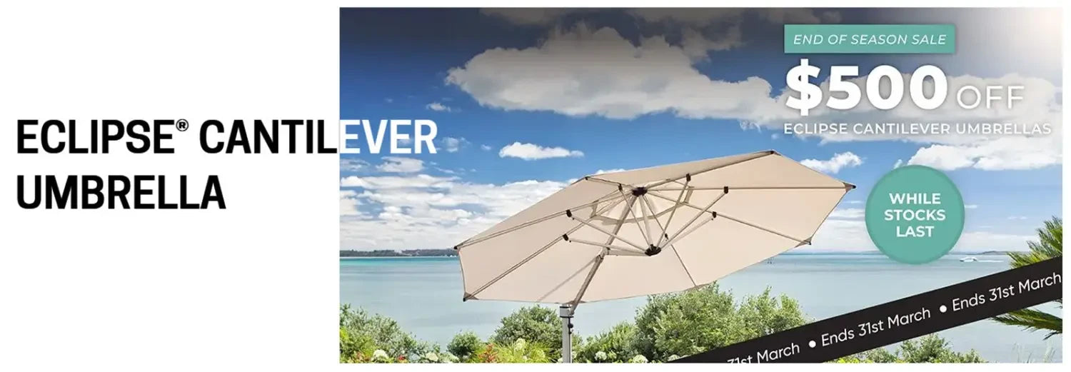 Beige cantilever umbrella over coastal scene in Eclipse Umbrella collection.