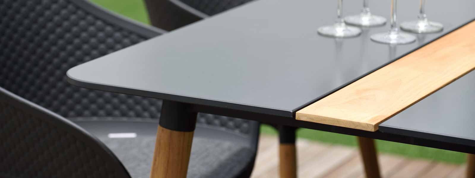 Modern dining table with two-tone top and wooden legs in Mixed Materials Furniture collection