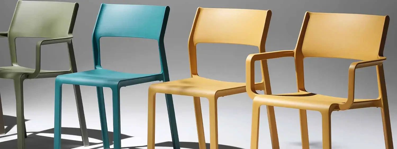 Colorful modern outdoor dining chairs in green, blue, and yellow showcasing a sleek design