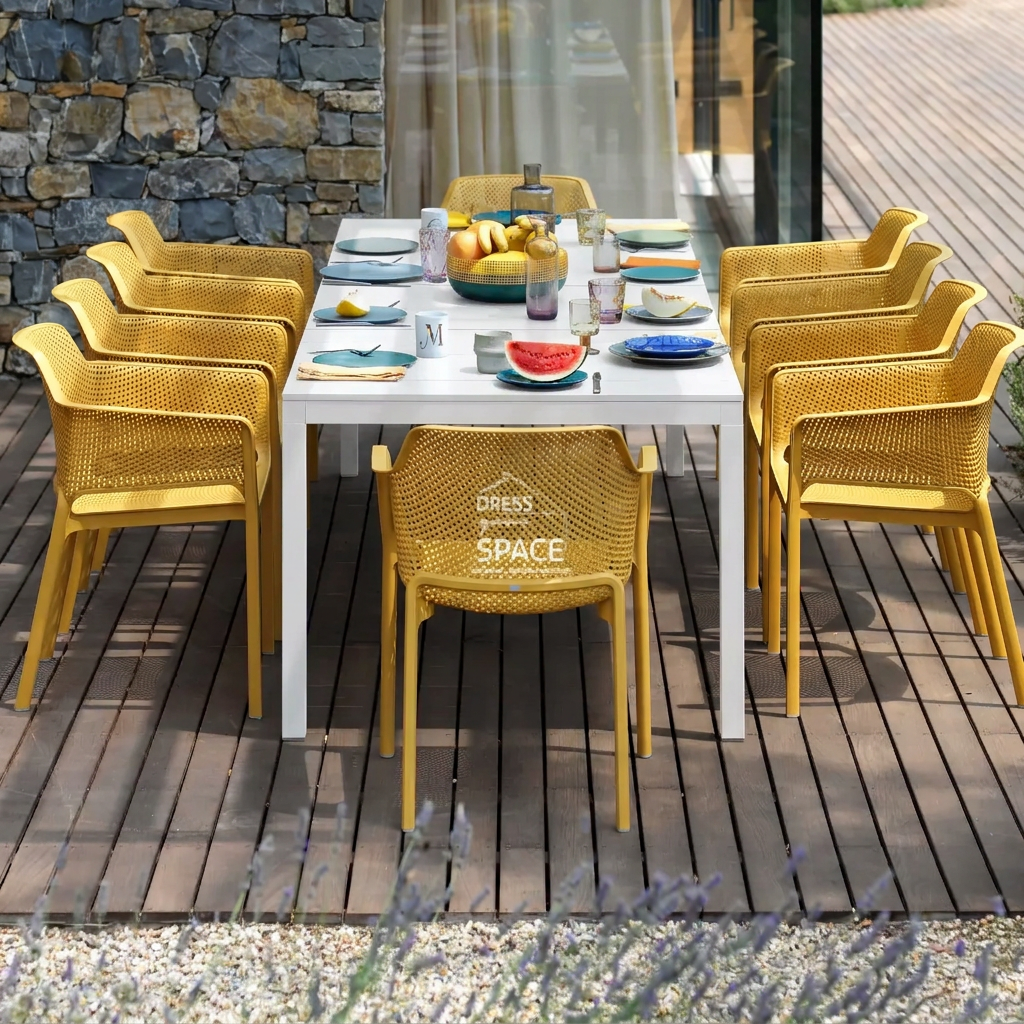 Outdoor dining setting with the table changed to white and the mustard chairs retained
